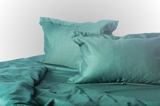 Styled emerald stripe sateen bed linen by Once@Home creating a rich and refined bedroom atmosphere