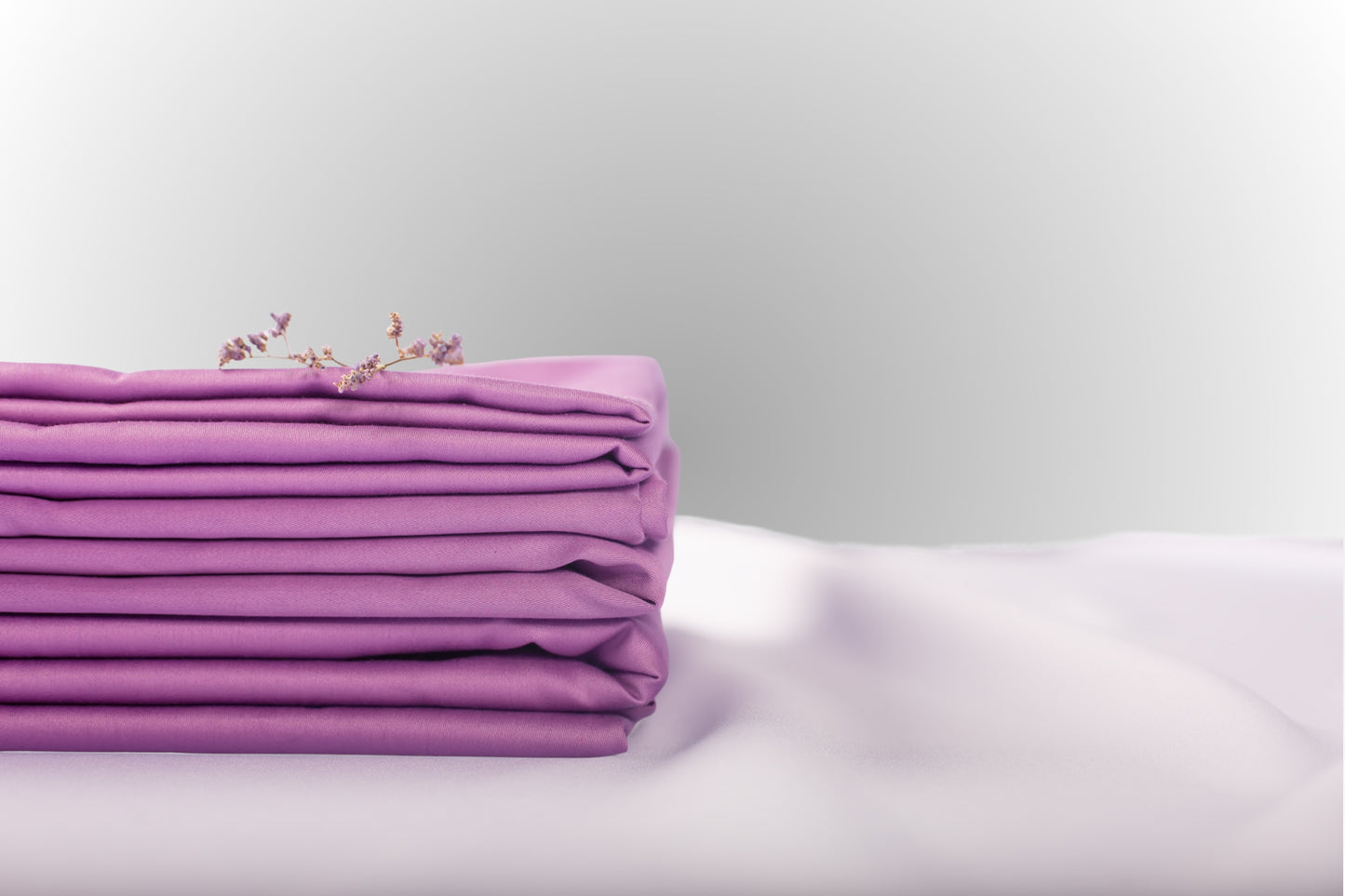 Texture detail of purple sateen bed linen by Once@Home with subtle sheen and soft touch