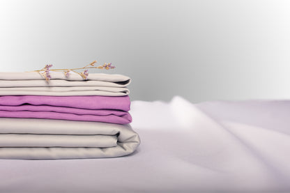Texture detail of silver and purple sateen bed linen by Once@Home with subtle sheen and soft touch