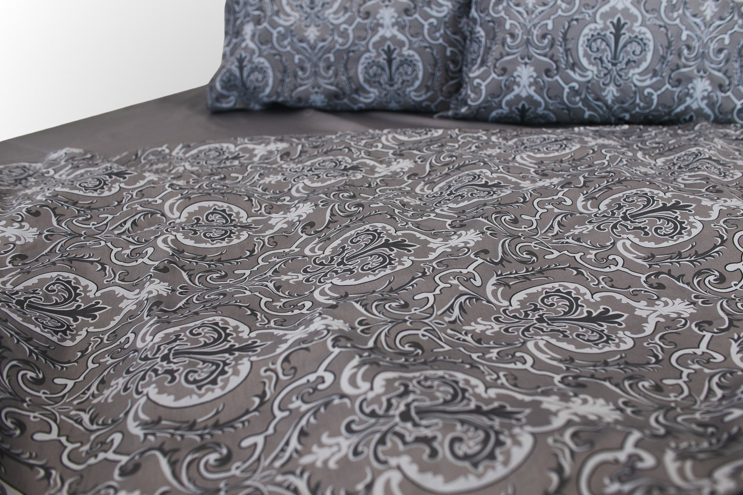 Detail of grey floral sateen bed linen  by Once@Home showing refined print and smooth weave