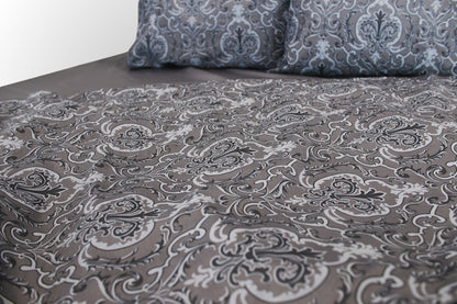 Detail of grey floral sateen bed linen  by Once@Home showing refined print and smooth weave