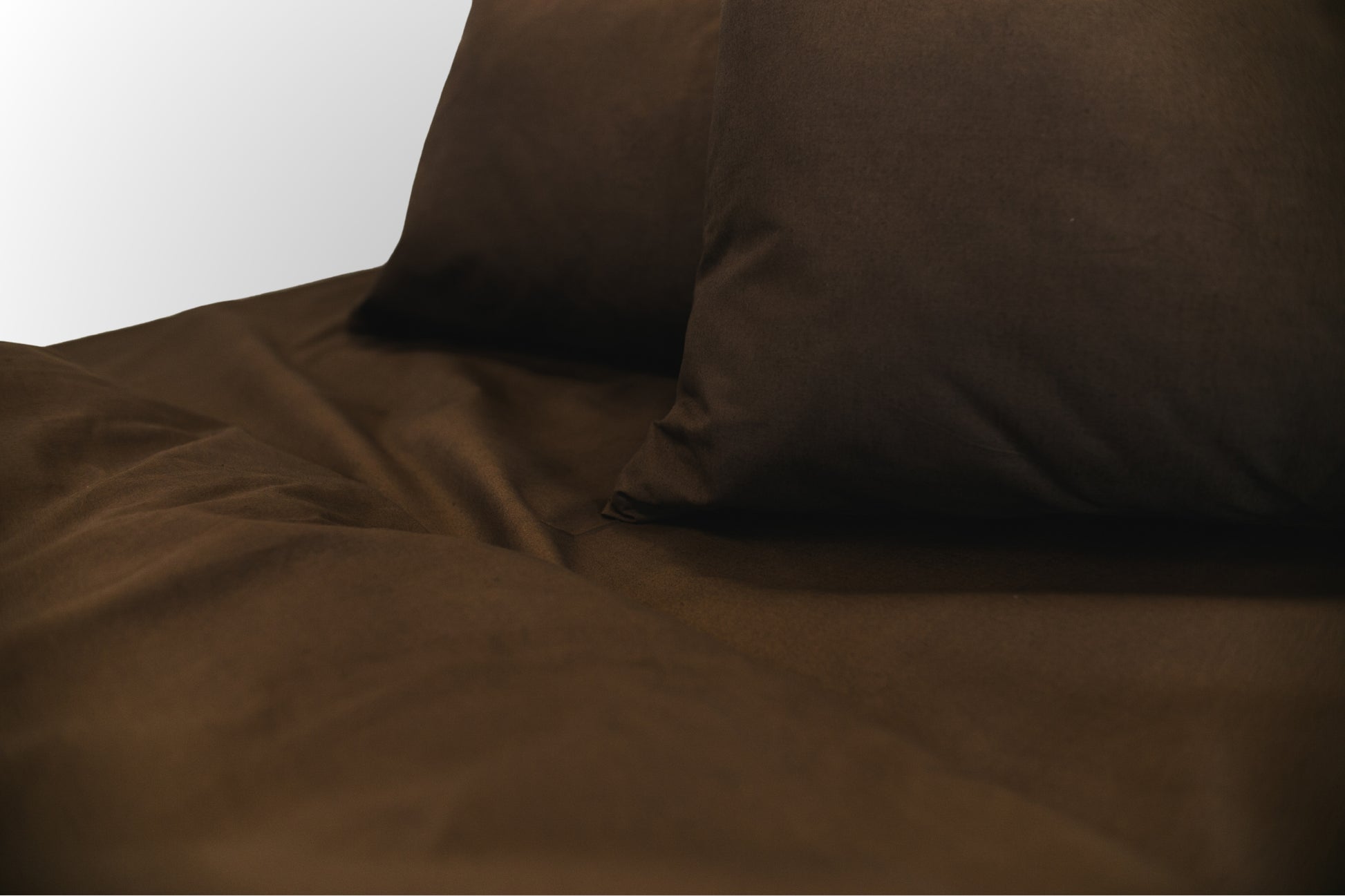 Close-up detail of brown ranforce bed linen by Once@Home showing natural cotton texture