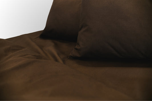 Close-up detail of brown ranforce bed linen by Once@Home showing natural cotton texture