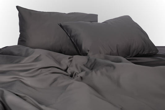 Styled black sateen bed linen by Once@Home creating a refined and sophisticated bedroom atmosphere