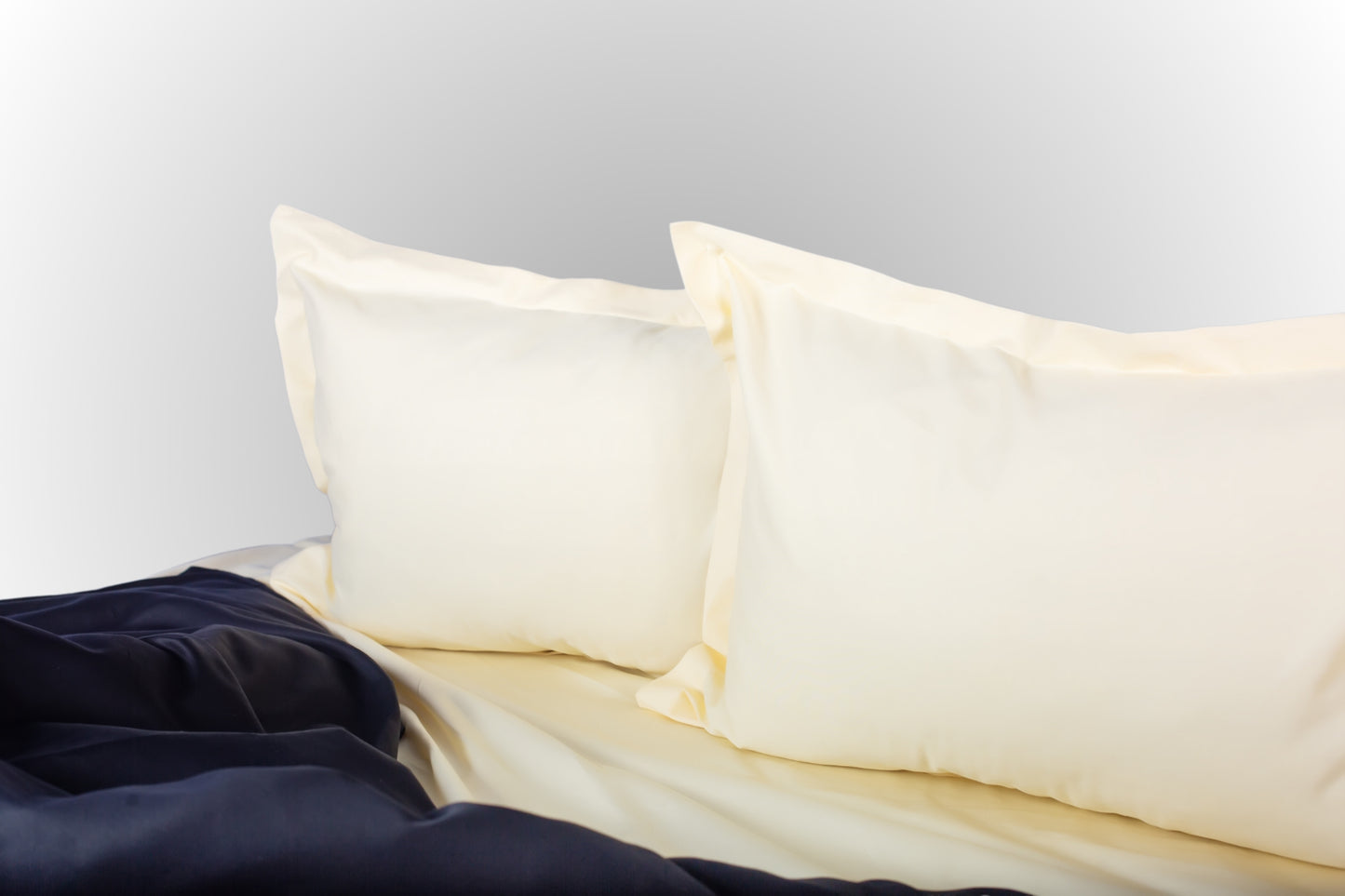 Styled cream and black sateen bed linen by Once@Home creating a calm and sophisticated bedroom atmosphere