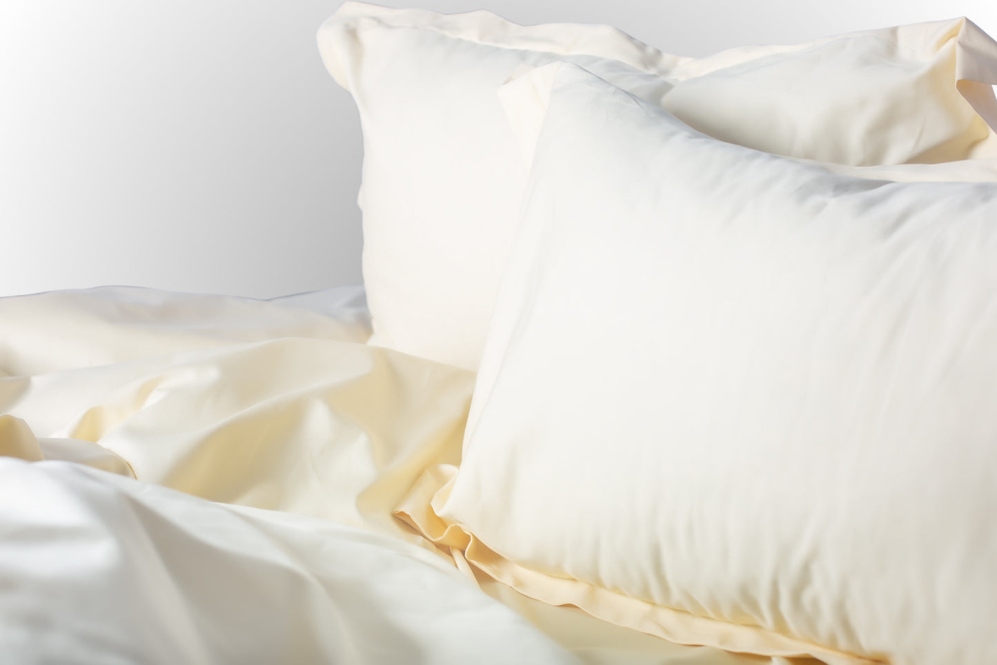 Styled cream sateen bed linen by Once@Home creating a calm and inviting bedroom atmosphere
