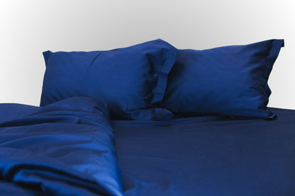 Dark blue sateen bed linen by Once@Home with silky smooth finish and elegant drape