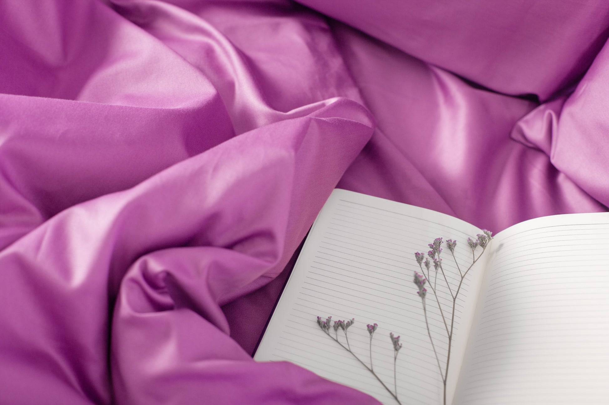 Close-up of purple sateen bed linen by Once@Home showing gentle folds and refined finish