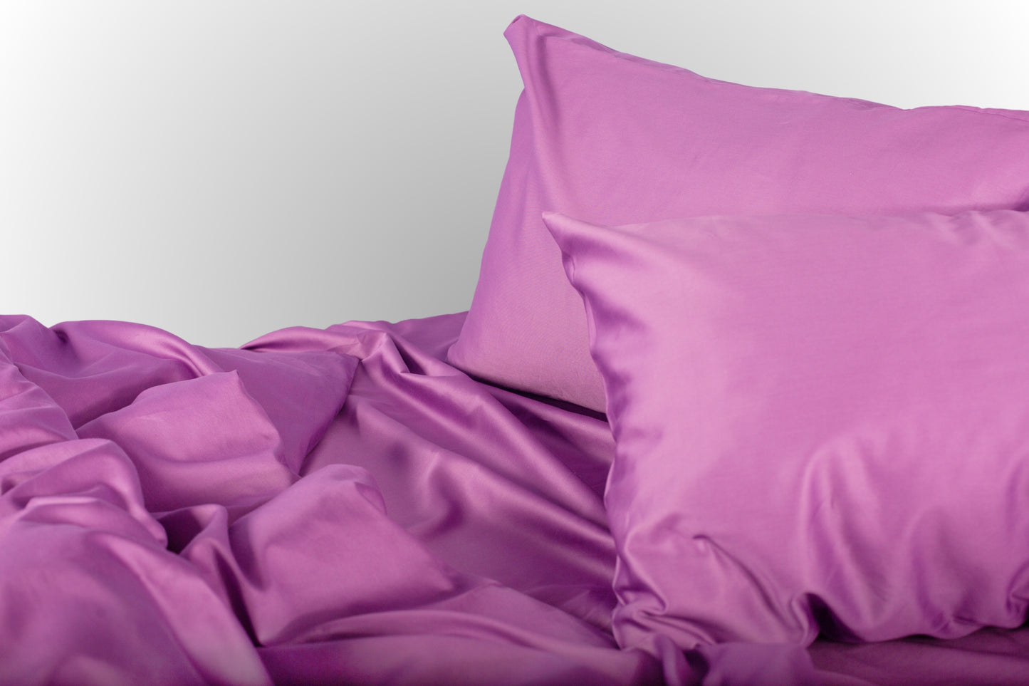 Styled purple sateen bed linen by Once@Home creating a calm and softly expressive bedroom atmosphere