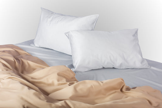 Styled silver-beige sateen bed linen by Once@Home creating a calm and modern bedroom atmosphere