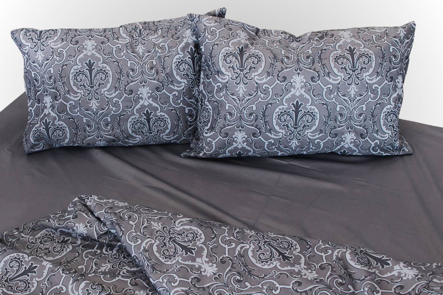 Studio image of grey floral sateen bed linen by Once@Home in a clean, minimalist setting