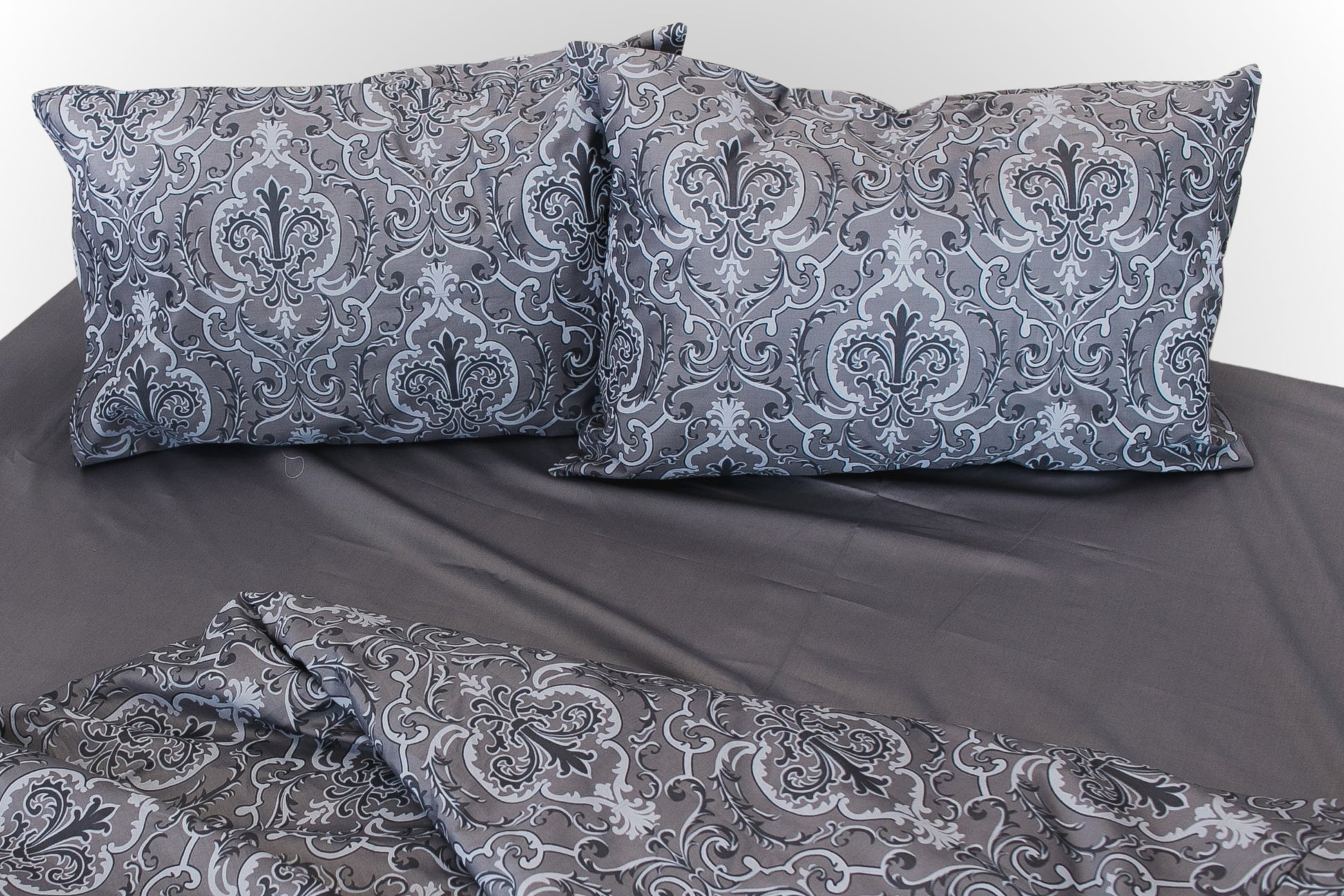 Studio image of grey floral sateen bed linen by Once@Home in a clean, minimalist setting