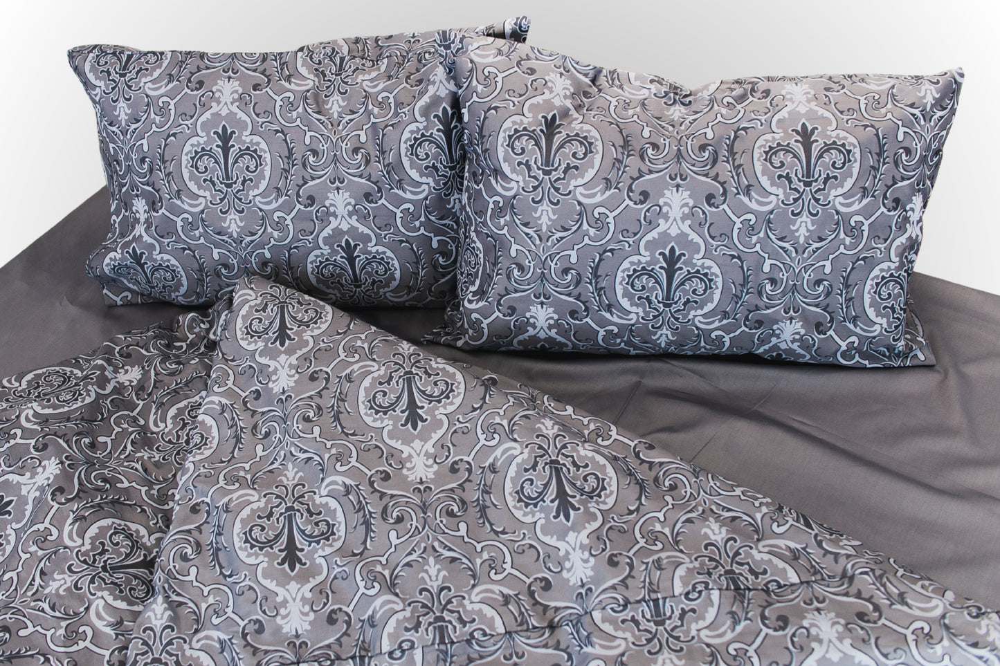 Styled grey floral sateen bed linen by Once@Home arranged in a calm, elegant interior