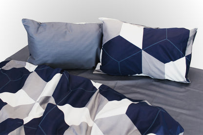 Studio image of geometric sateen bed linen by Once@Home in blue, grey, white and beige