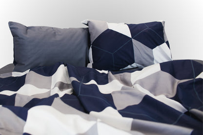 Styled geometric sateen bed linen by Once@Home arranged in a calm, modern interior