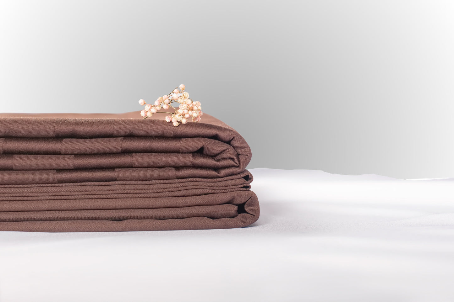 Texture detail of brown stripe sateen bed linen by Once@Home with subtle sheen and soft touch