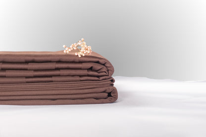 Texture detail of brown stripe sateen bed linen by Once@Home with subtle sheen and soft touch